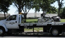 Tow Truck with Motorcycle above — Lockouts in Sacramento, CA