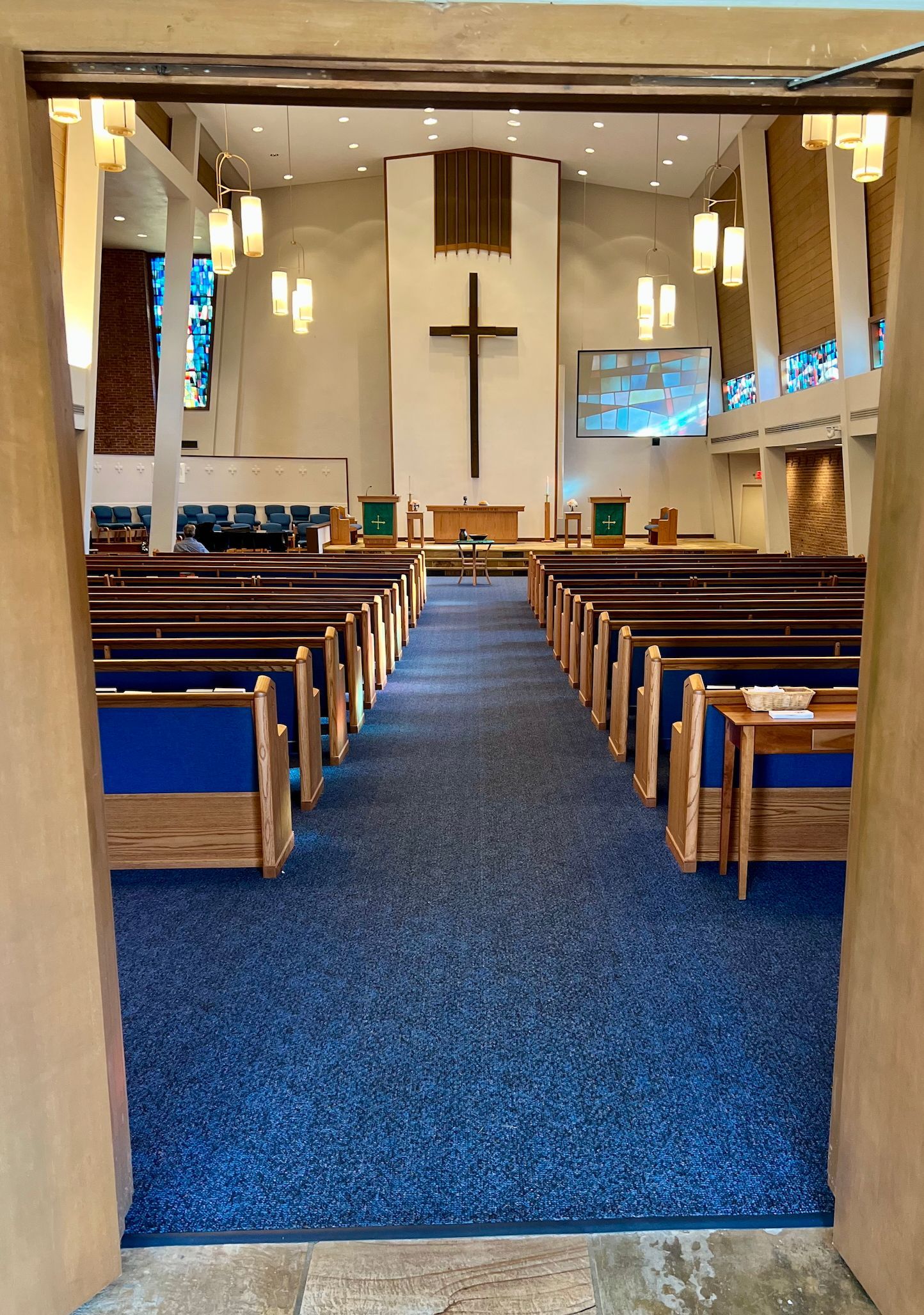 Jesus is standing in front of a crowd of people
