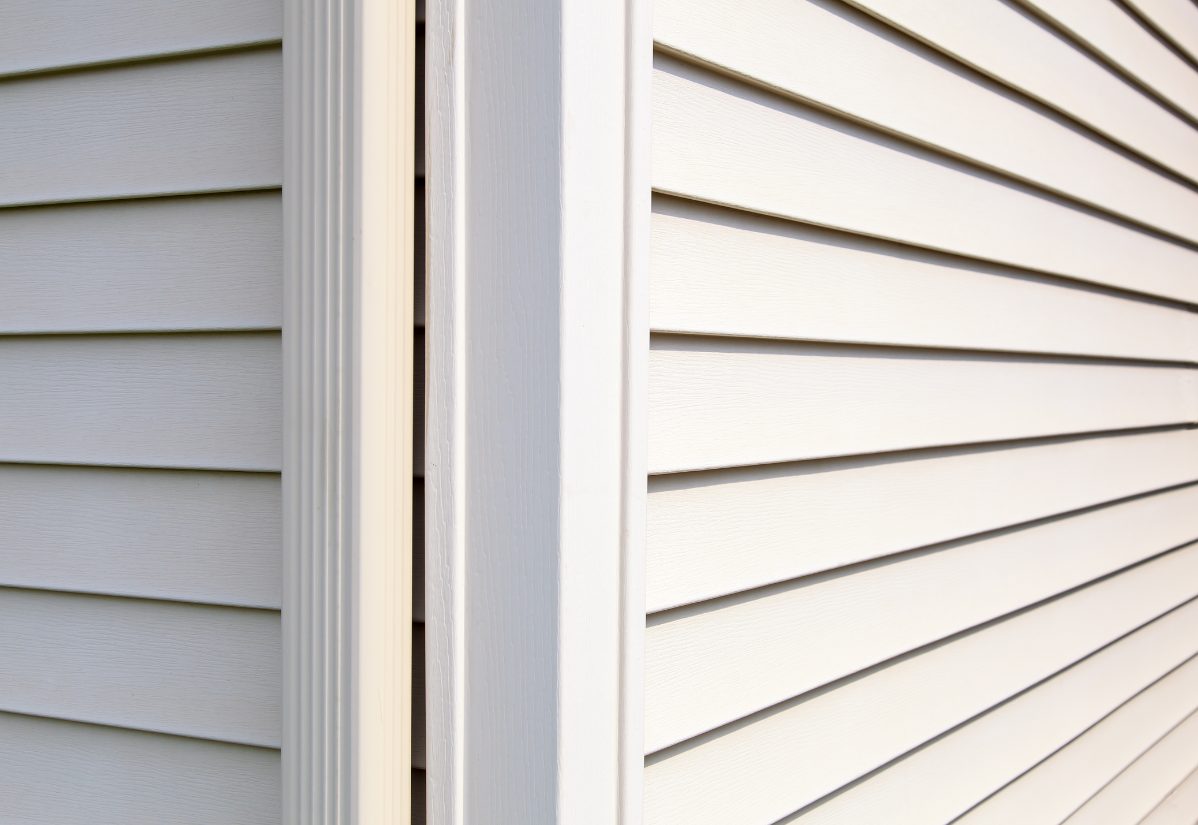A close up of a white siding on a house