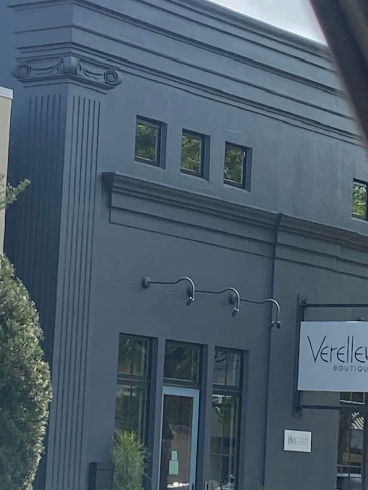A black building with a sign that says verelle on it