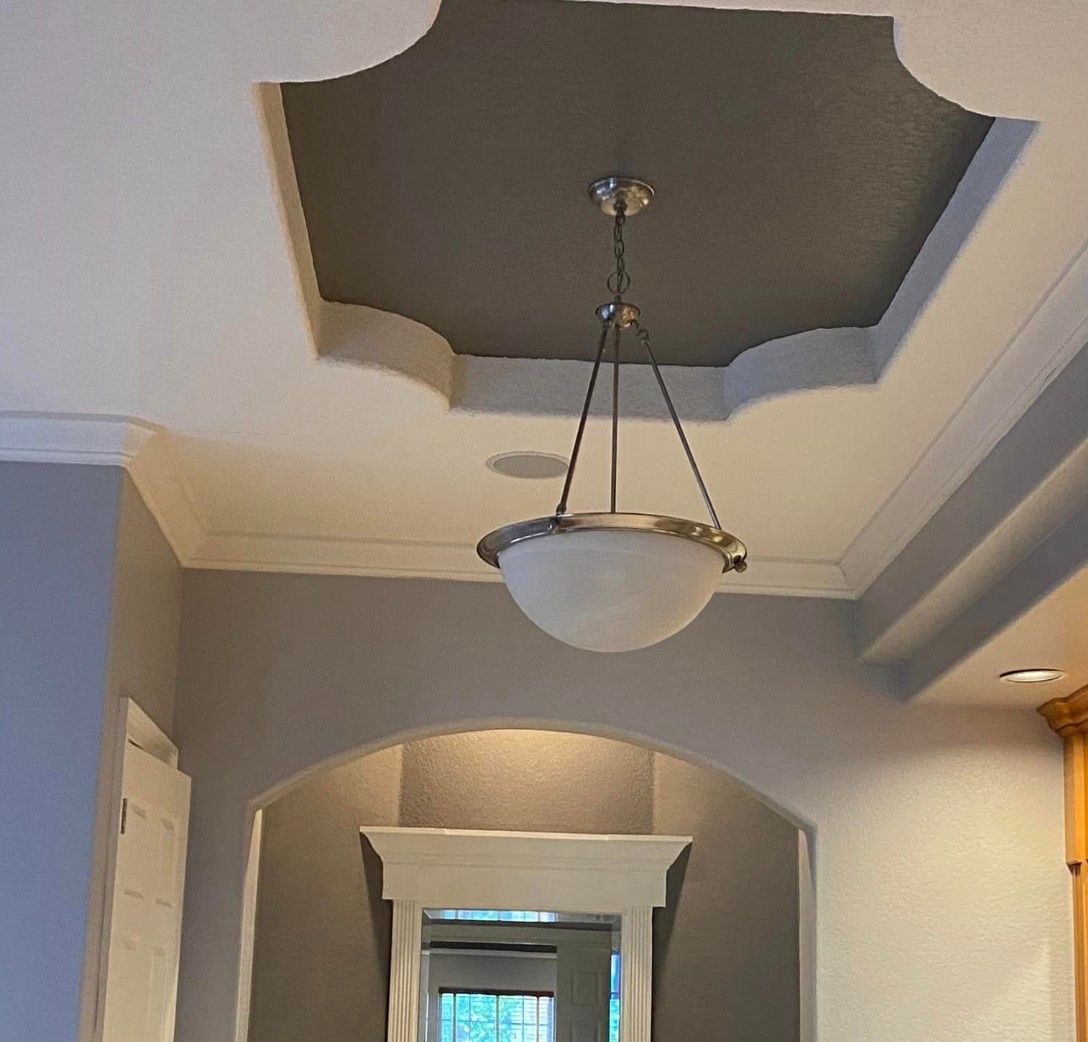 A hallway with a chandelier hanging from the ceiling