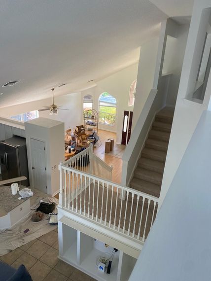 An aerial view of a house under construction with stairs leading up to the second floor.