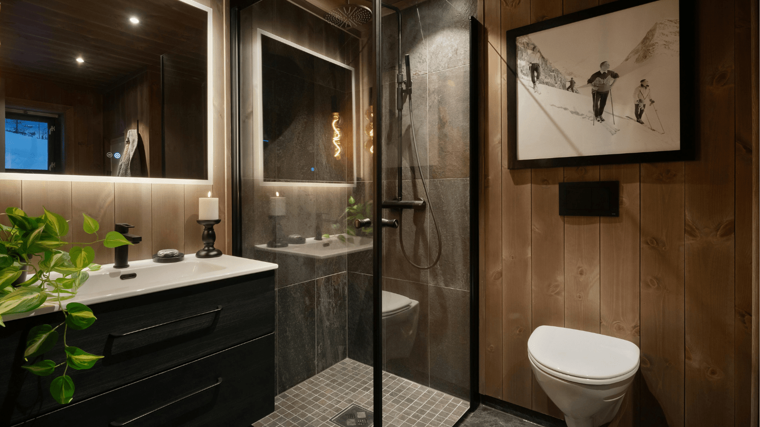 Modern bathroom with wood paneling, glass shower, black vanity, and art — Intolec Electrical In Tweed Heads, NSW
