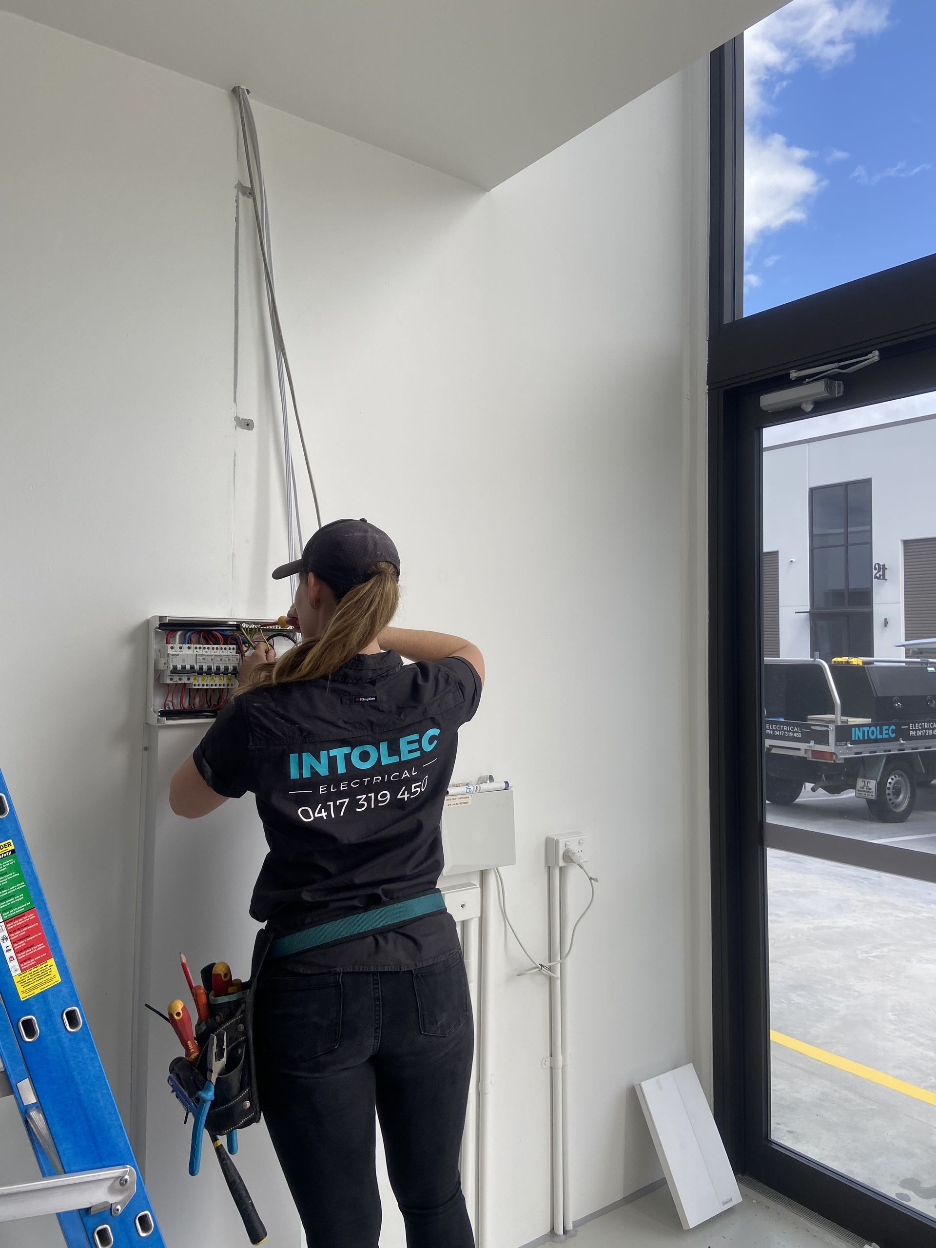 Gray Rubber Flooring, Concrete Pillars, Bright Overhead Lighting, Large Windows — Intolec Electrical In Tweed Heads, NSW