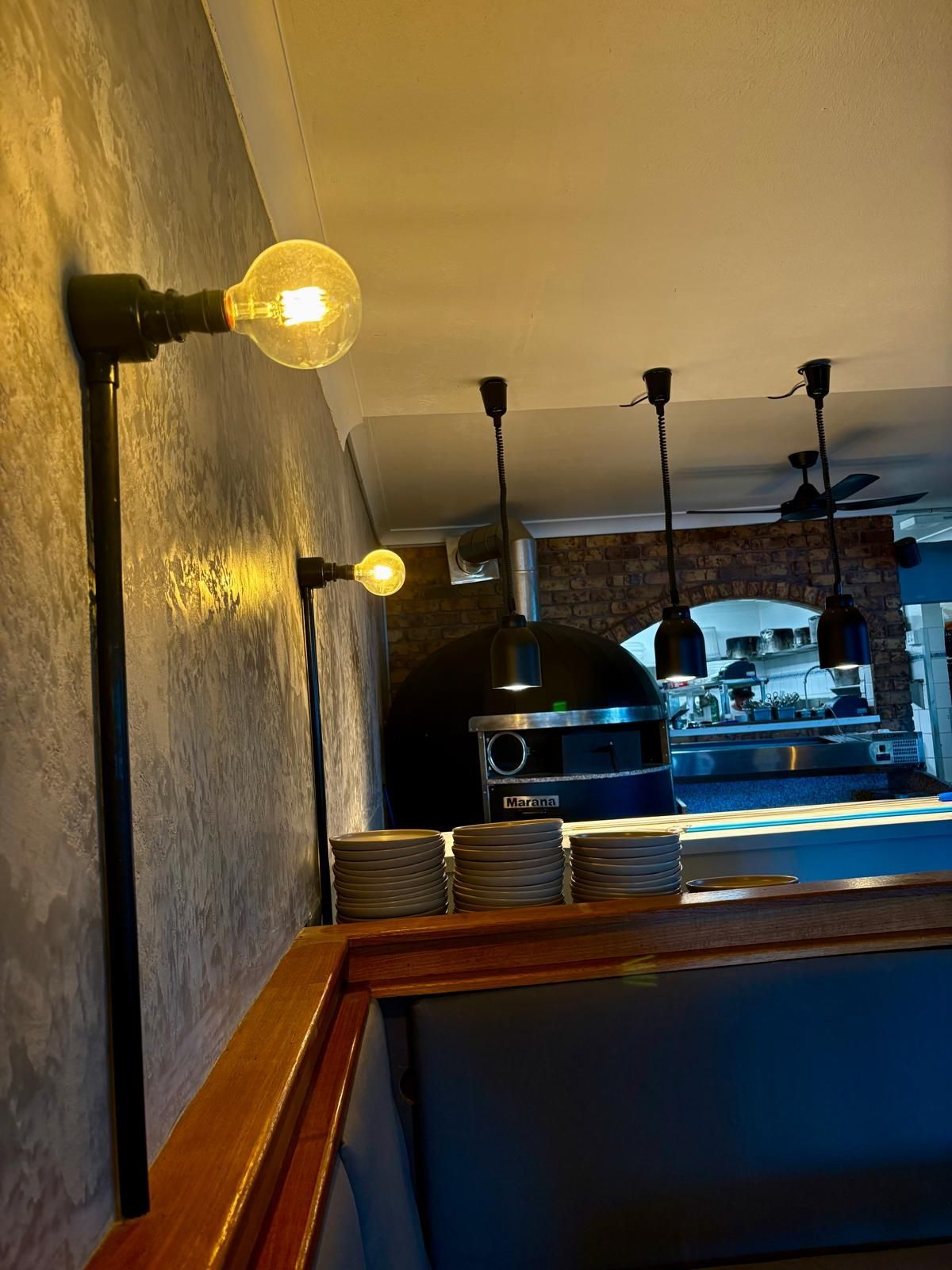 Industrial Wall Sconces With Edison Bulbs Illuminate a Restaurant — Intolec Electrical in Tweed Heads, NSW