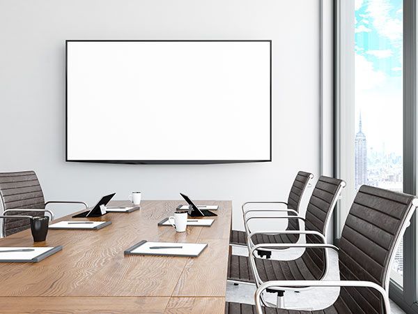 Red construction lift in parking garage. Entrance ahead, lights overhead. — Intolec Electrical In Tweed Heads, NSW
