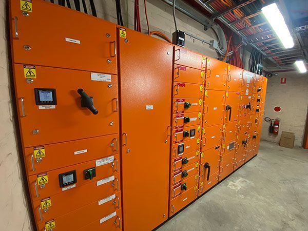 Gym interior with rubber flooring, a concrete pillar, and large windows. — Intolec Electrical In Tweed Heads, NSW