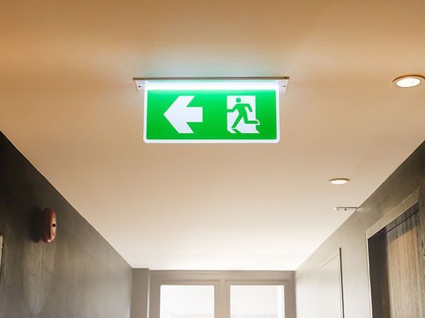 White Emergency Light Fixture on a Blue and White Wall — Intolec Electrical In Kingscliff, NSW