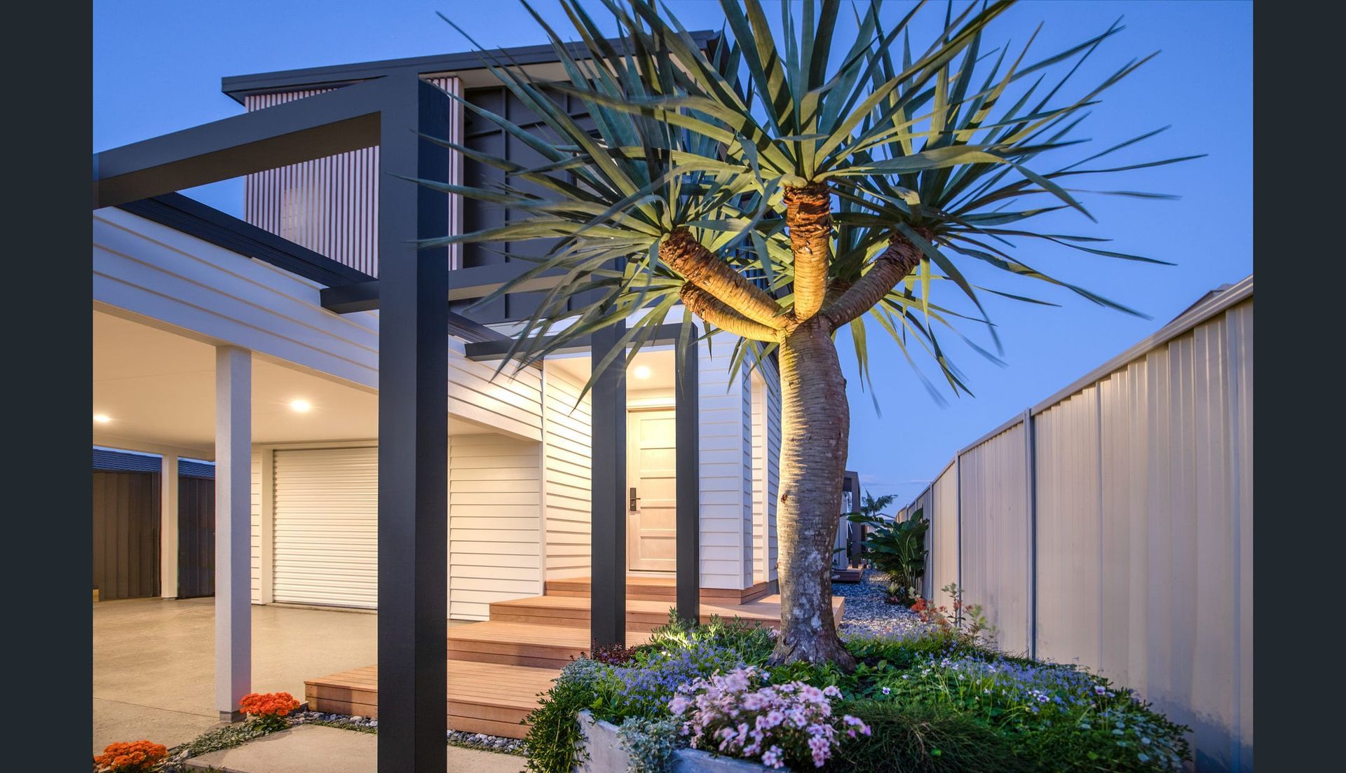 Modern Home Exterior With a Tree Illuminated at Dusk — Intolec Electrical in Tweed Heads, NSW