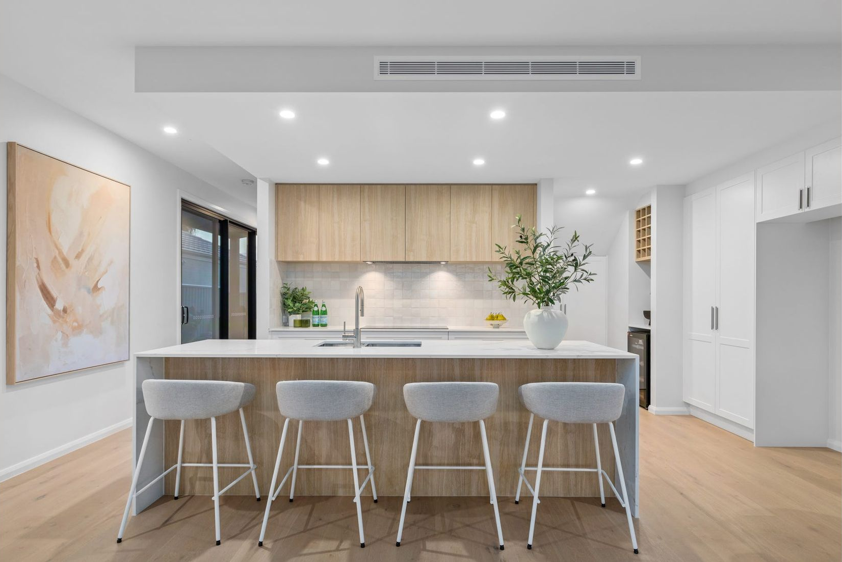 Nighttime view of a pool nestled under tropical trees, illuminated with blue light. — Intolec Electrical In Tweed Heads, NSW
