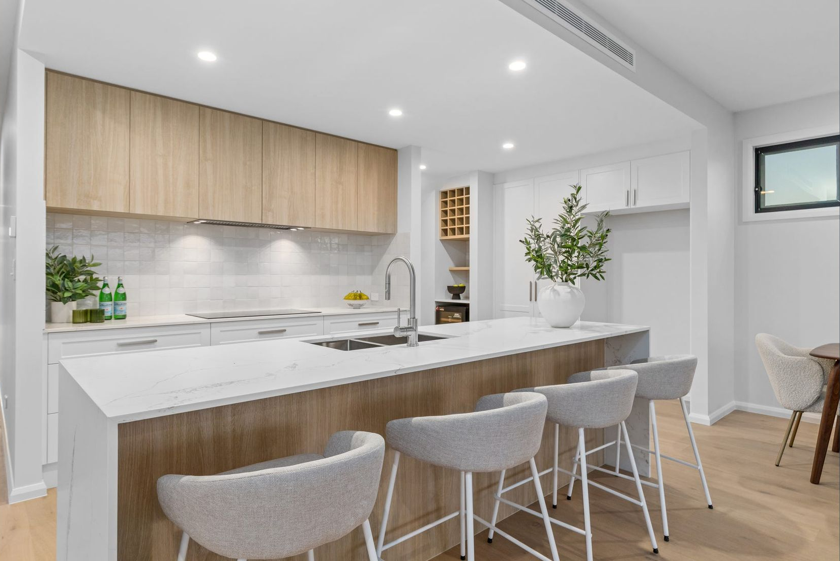 Kitchen With Blue Cabinets, Wooden Island, and Black Appliances — Intolec Electrical In Tweed Heads, NSW