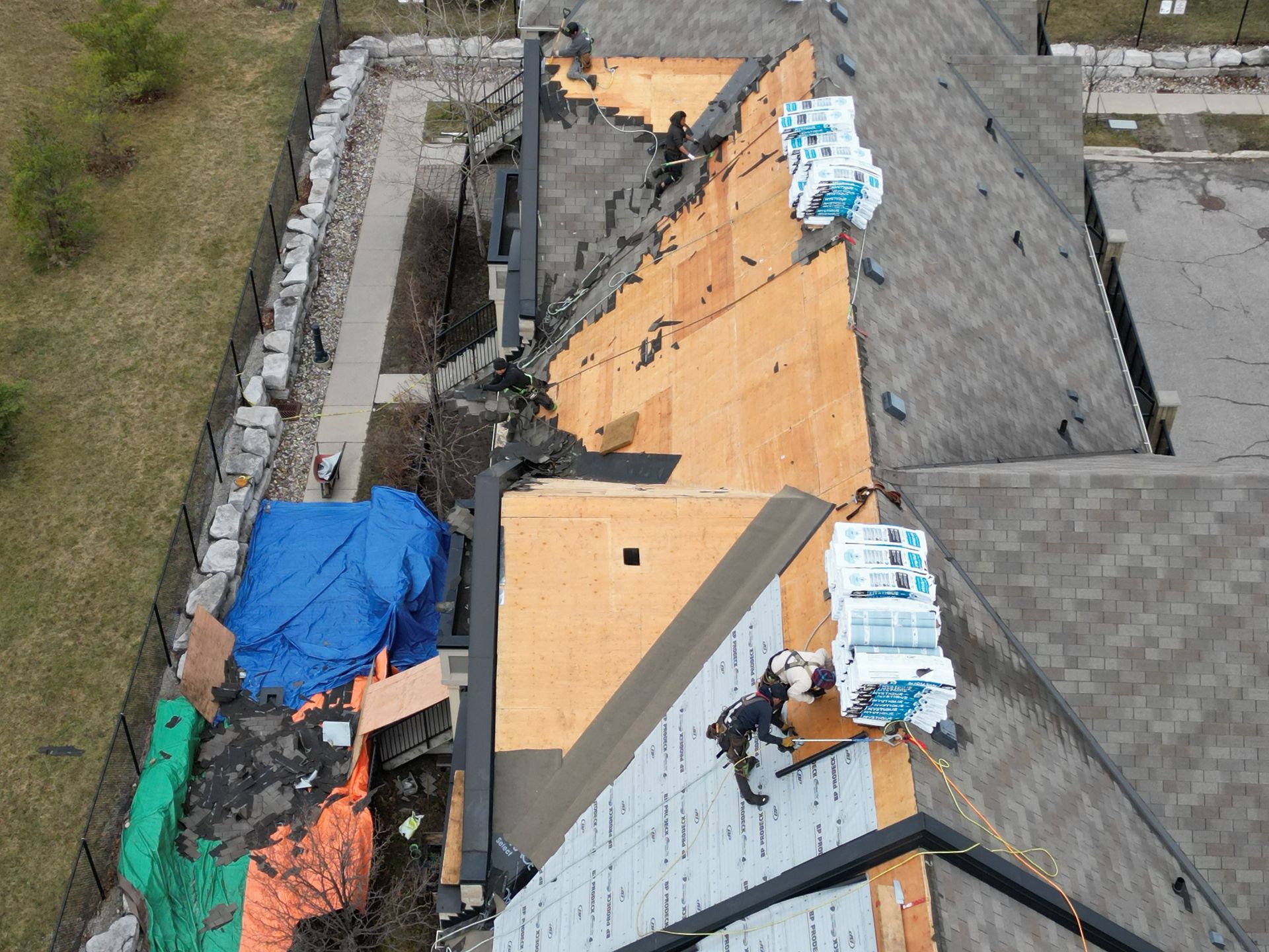 An aerial view of a roof that is being repaired