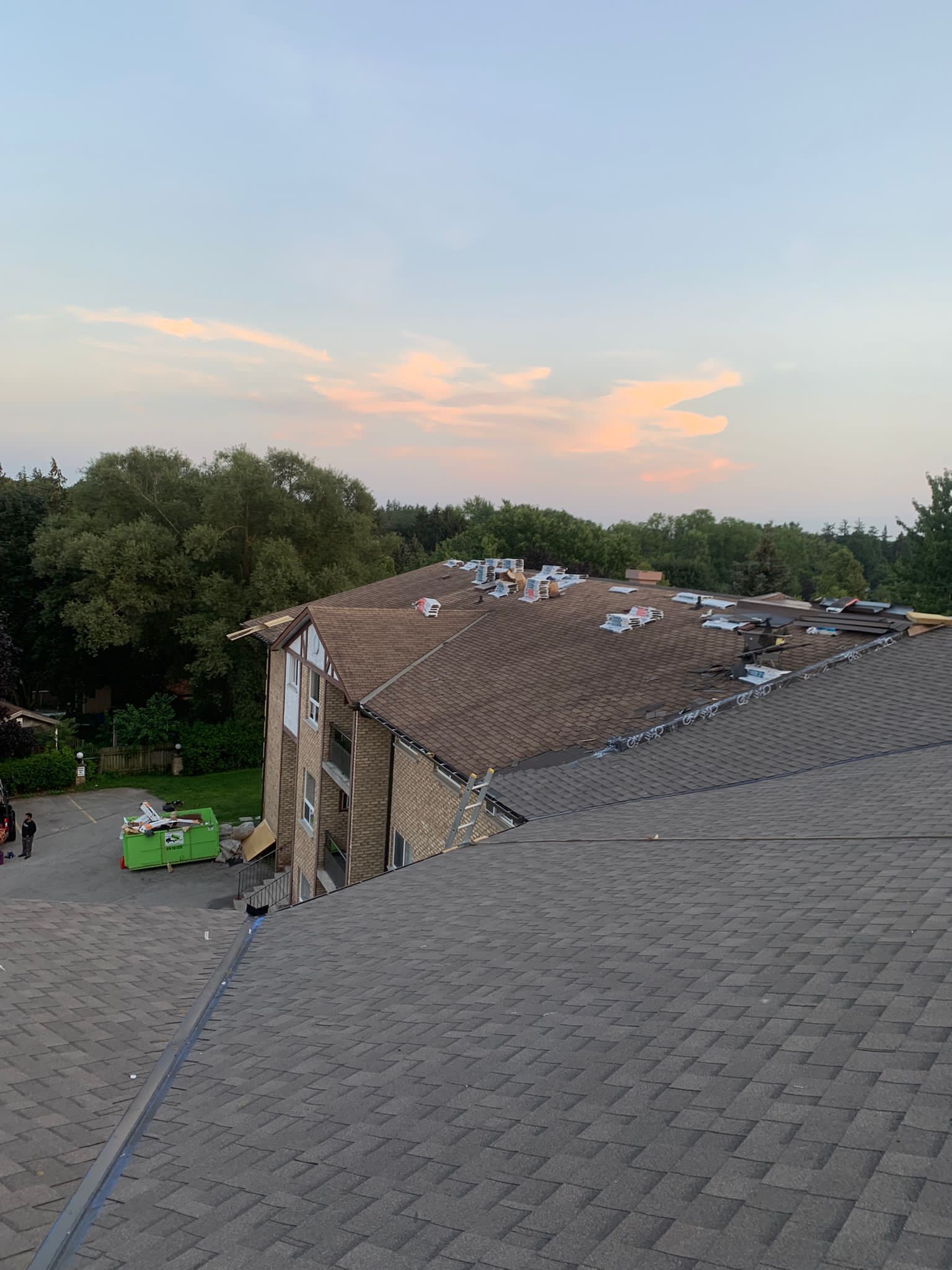 A roofing working on the roof of a building