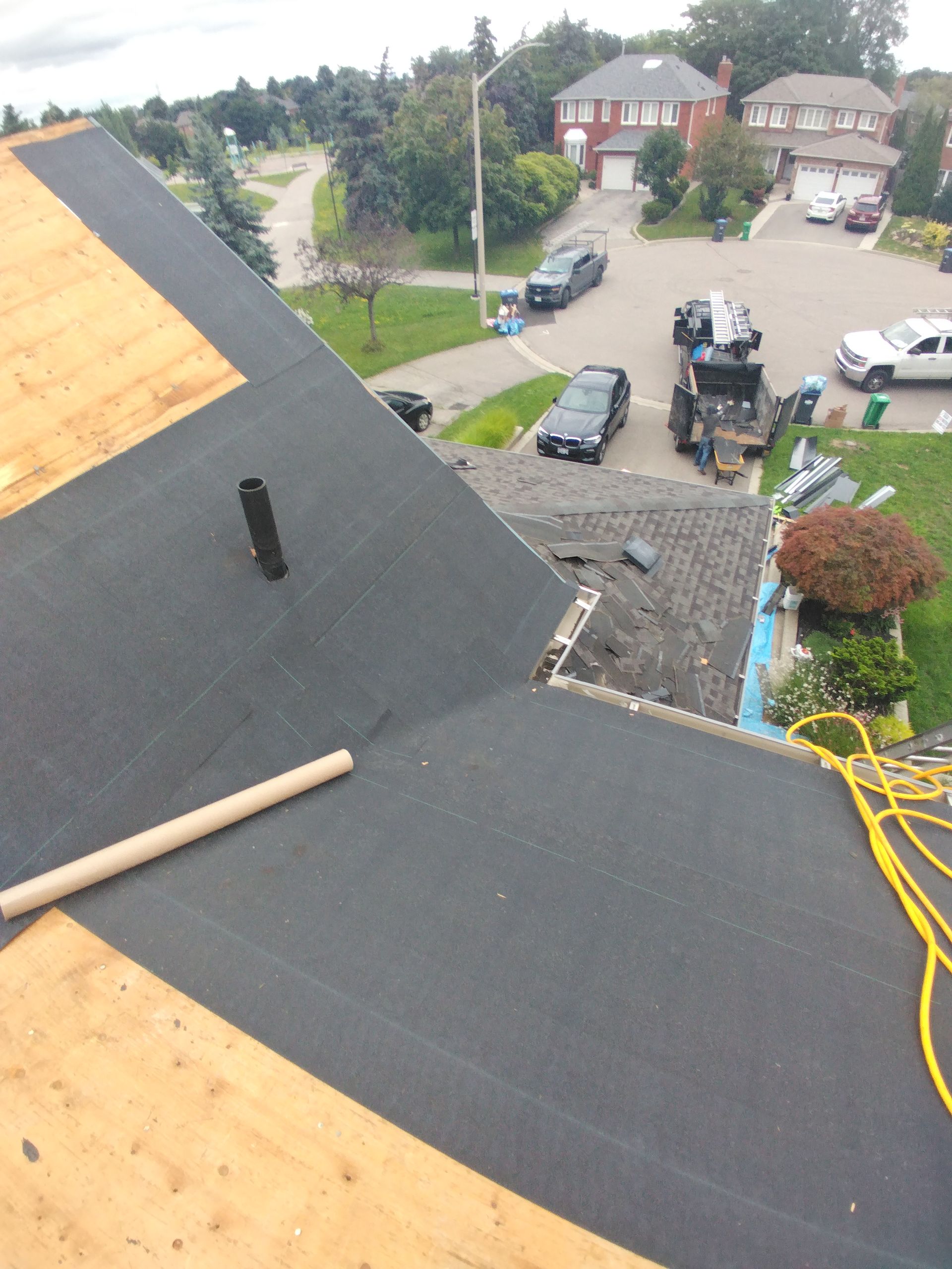 An aerial view of a roof with a hose attached to it