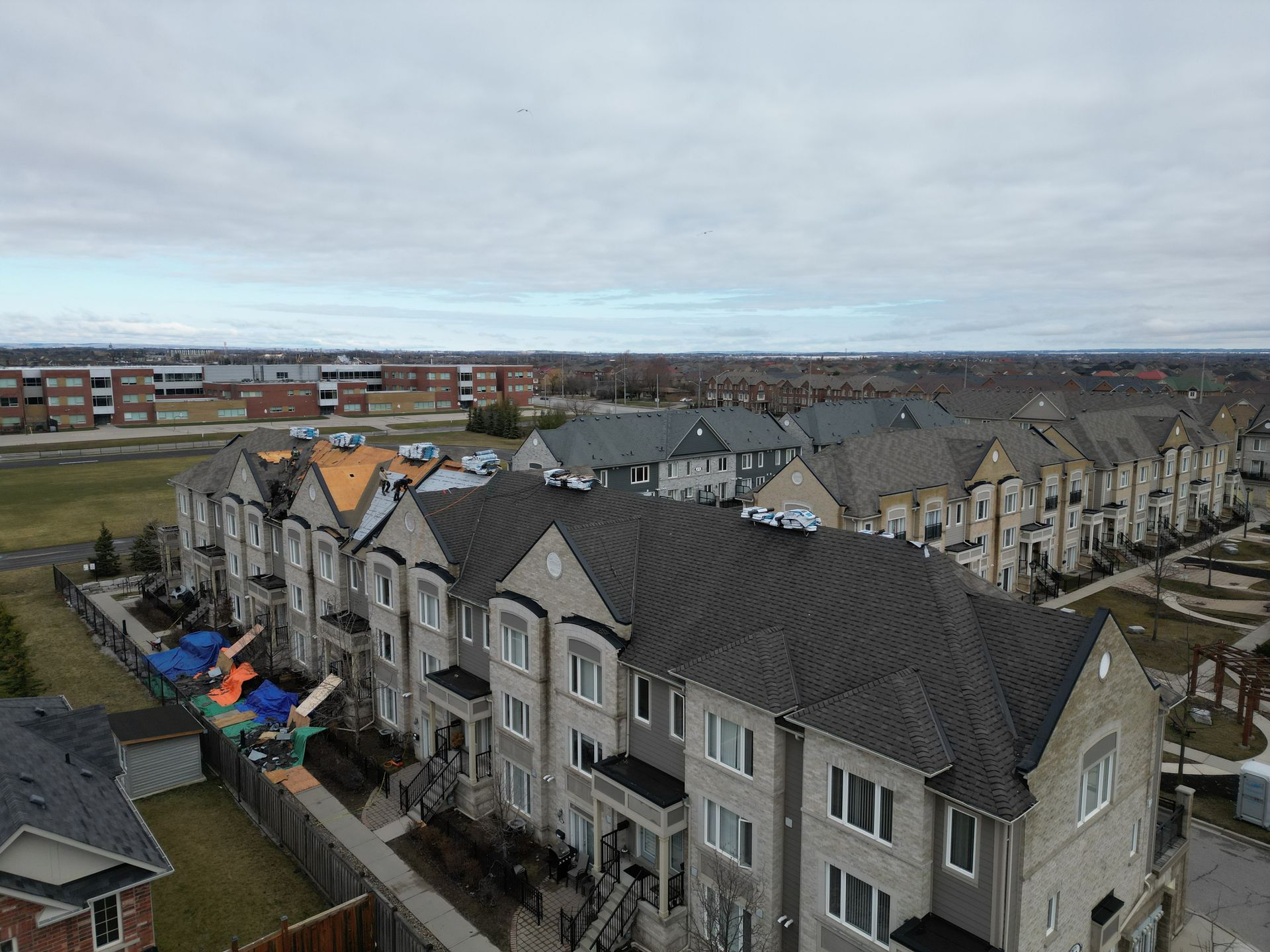 An aerial view of a row of houses in a residential area.