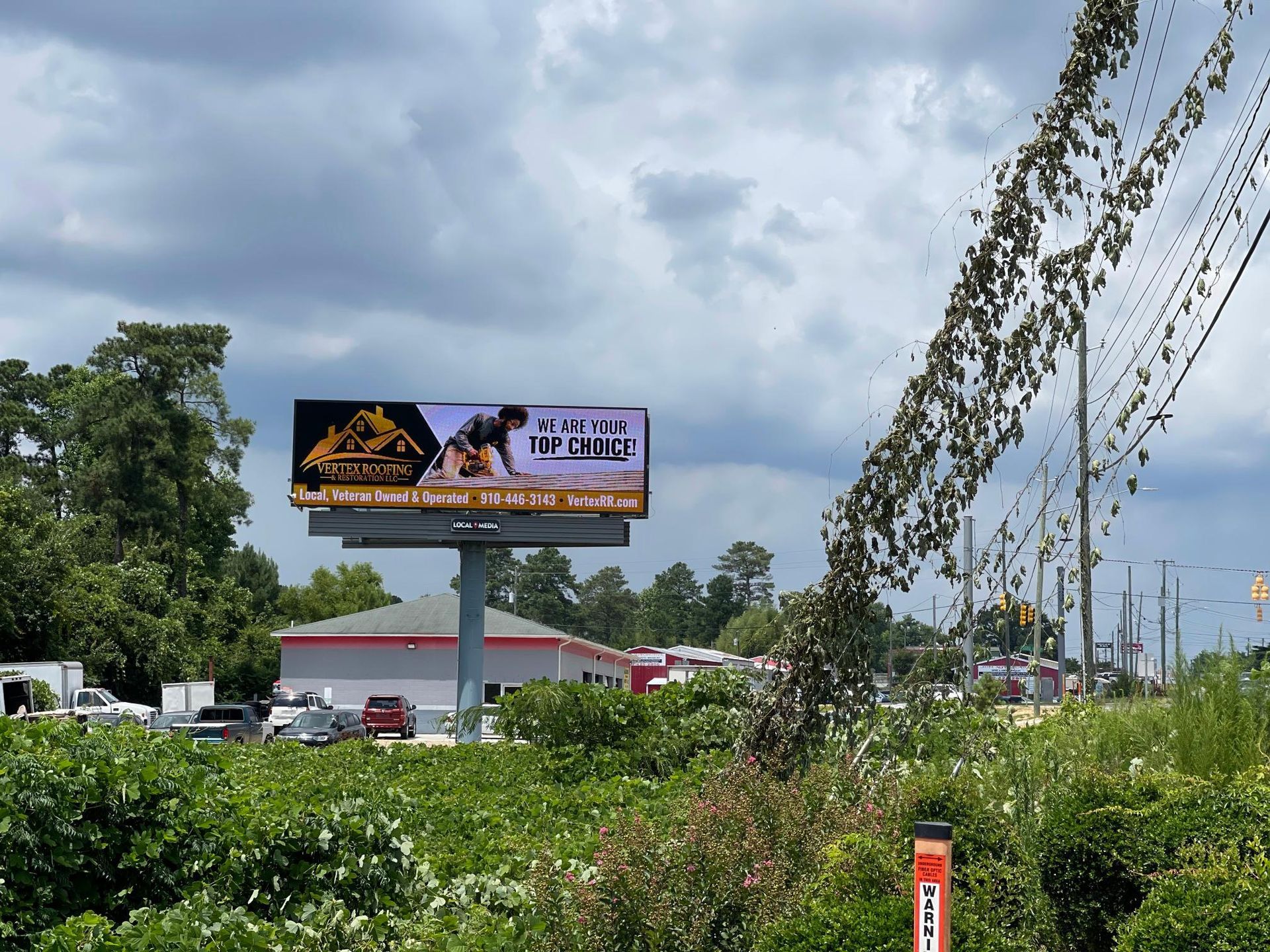 A billboard with a picture of a bulldozer on it