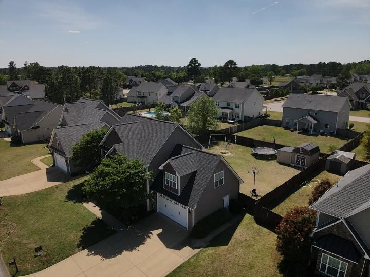 An aerial view of a residential neighborhood with lots of houses