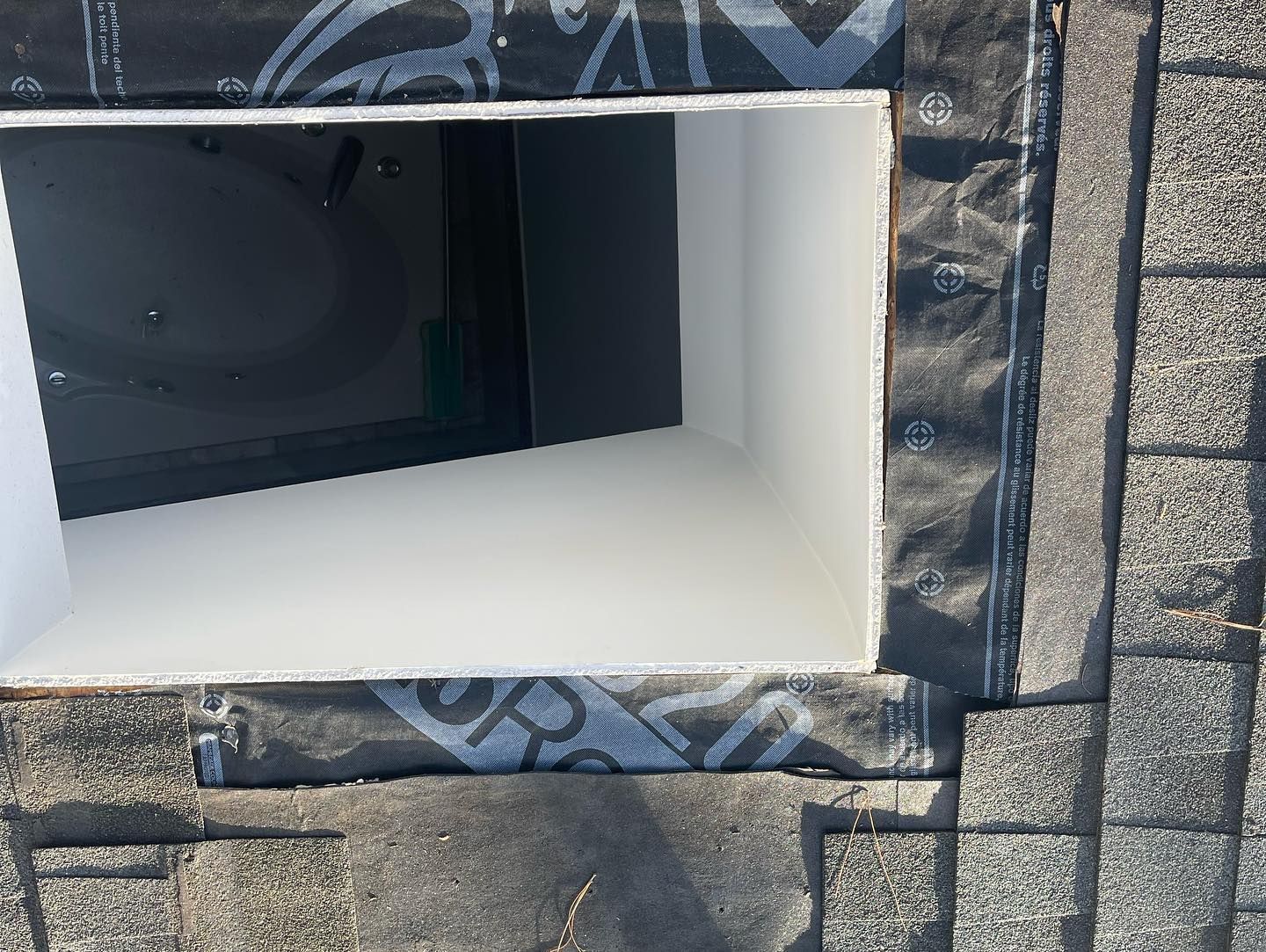 A brick wall with a white box in the middle of it