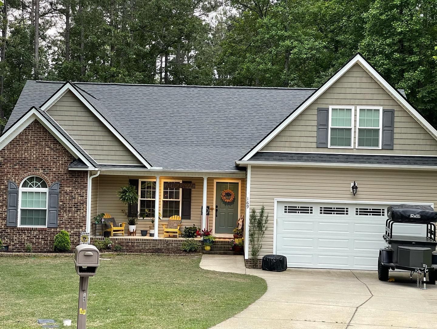 A house with a golf cart parked in front of it.