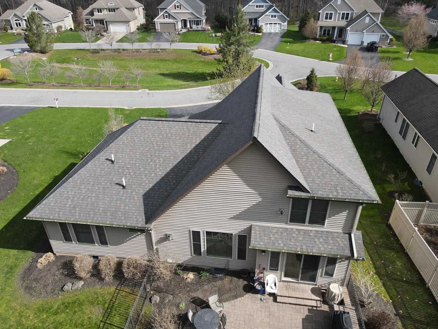 An aerial view of a house in a residential area