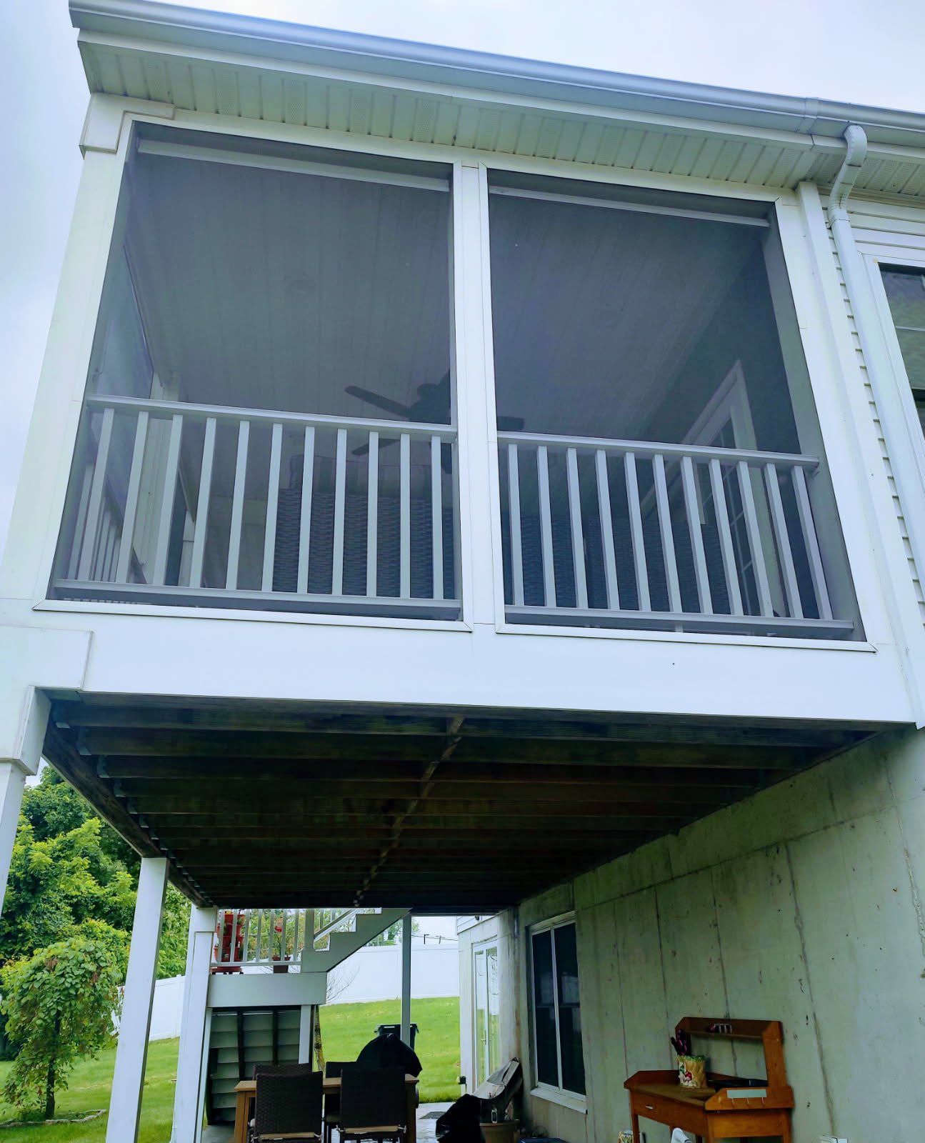 Screened-in porch attached to a house. 