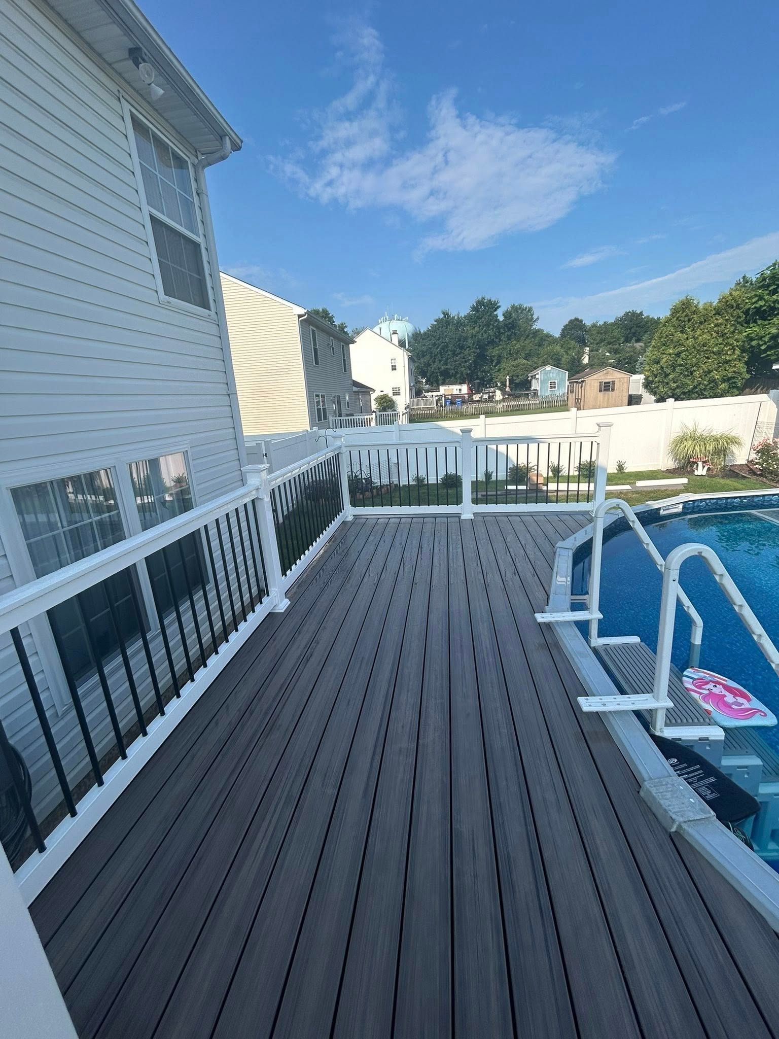 Deck beside a swimming pool.