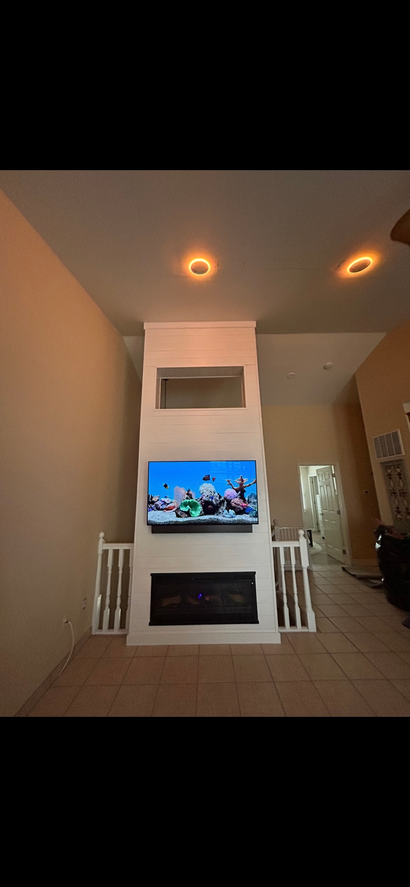 Room renovation with exposed wooden beams, drywall, and dark blue wall. Room renovation with exposed wooden beams, drywall, and dark blue wall.