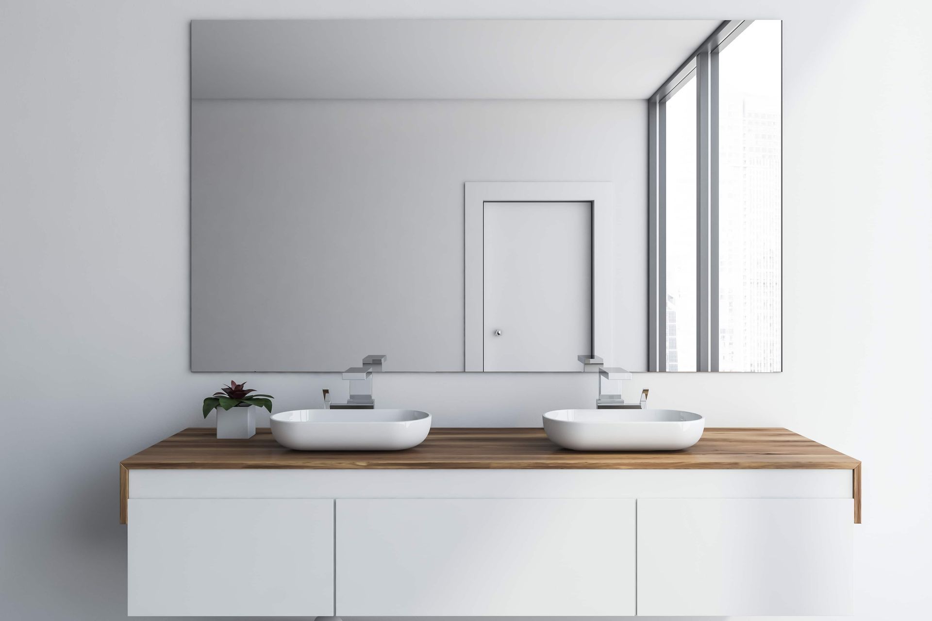A Bathroom With Two Sinks and a Large Mirror — Hayes & Swinburn Glass in Westcourt, QLD