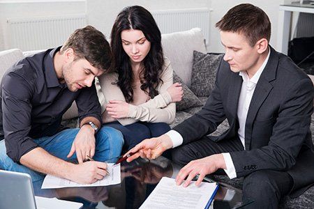 Legal Contract — Couple Signing a Contract with a Lawyer in Reno, NV
