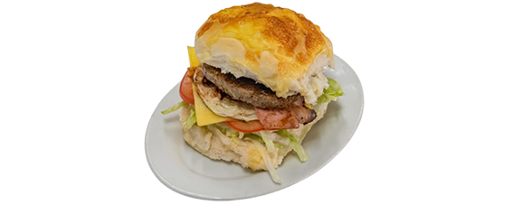 Hamburger with patty, cheese, tomato, and lettuce on a bun, on a white plate — Henri's Wodonga Bakery in Wodonga, VIC
