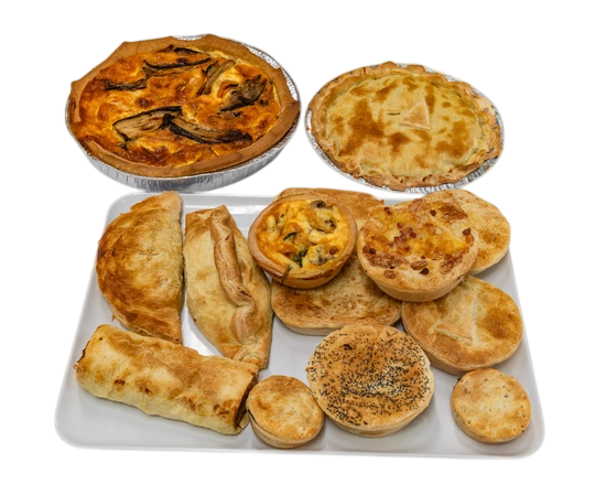Tray of assorted savory pastries: two quiches, sausage roll, pies, and empanadas — Henri's Wodonga Bakery in Wodonga, VIC