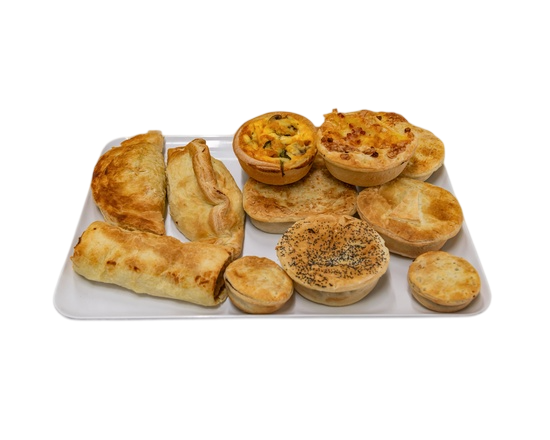 Assorted savory pies and tarts on a white platter, including a quiche and several individual pies  — Henri's Wodonga Bakery in Wodonga, VIC