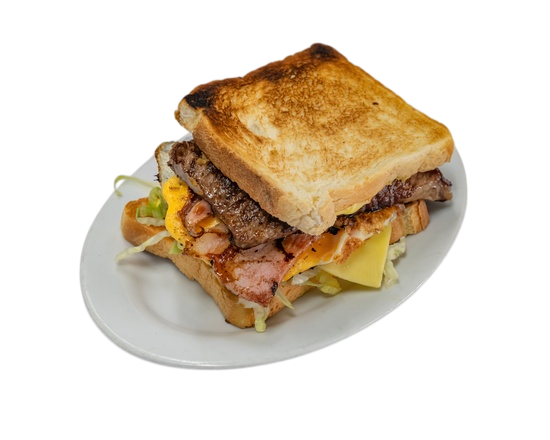 Club sandwich on a white plate: toasted bread, bacon, cheese, lettuce, and grilled meat  — Henri's Wodonga Bakery in Wodonga, VIC