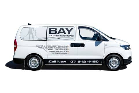 White Van with Bay Carpet Cleaning Tauranga Logo and Carpet Cleaning Services n the side