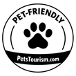 A black and white circular logo with a paw print in the center, labeled