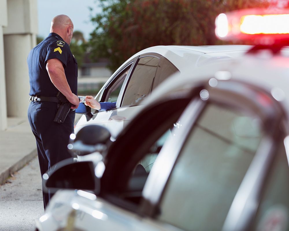 Police officer pulling over a car