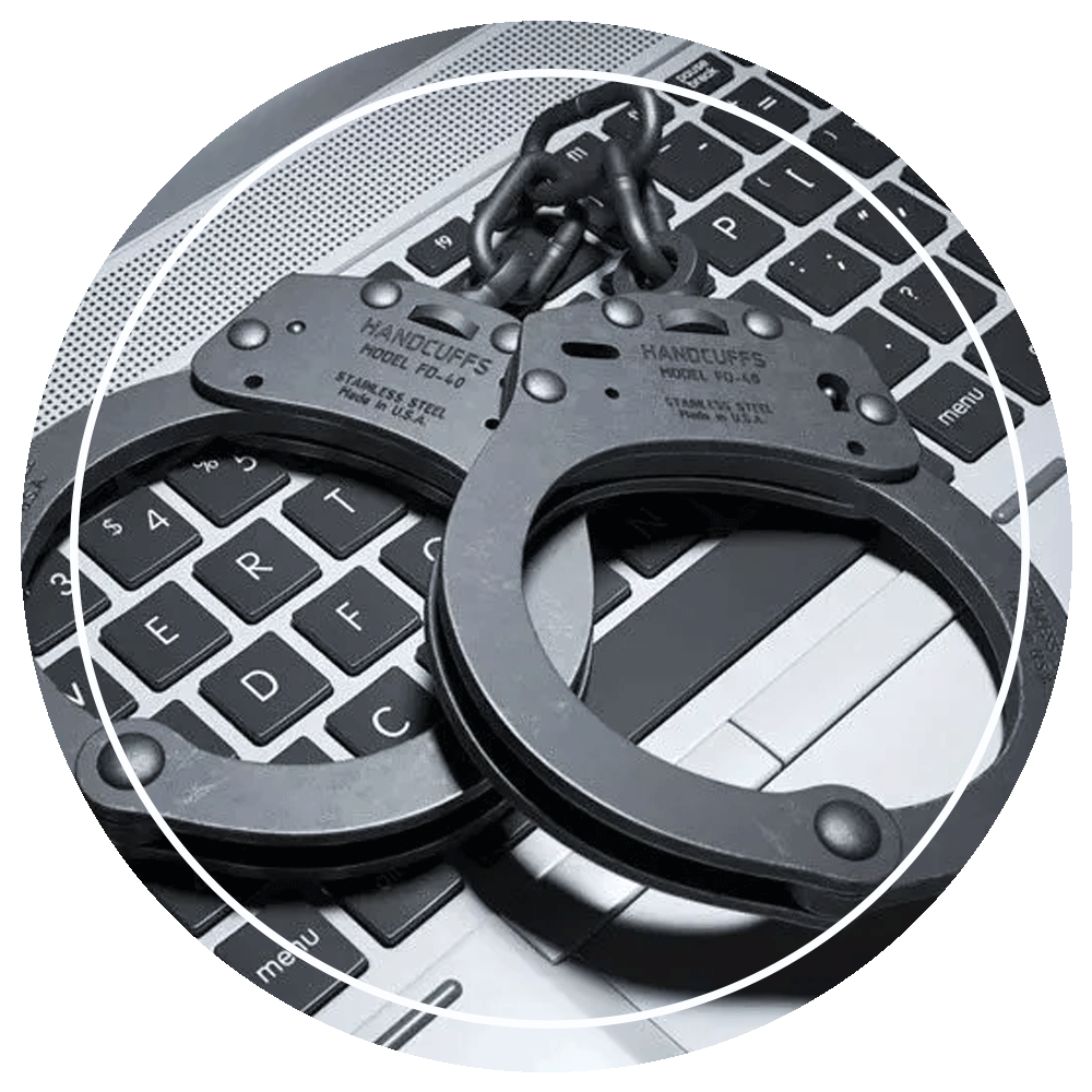 Handcuffs on Laptop Keyboard — Eau Claire, WI — Cohen Law Offices