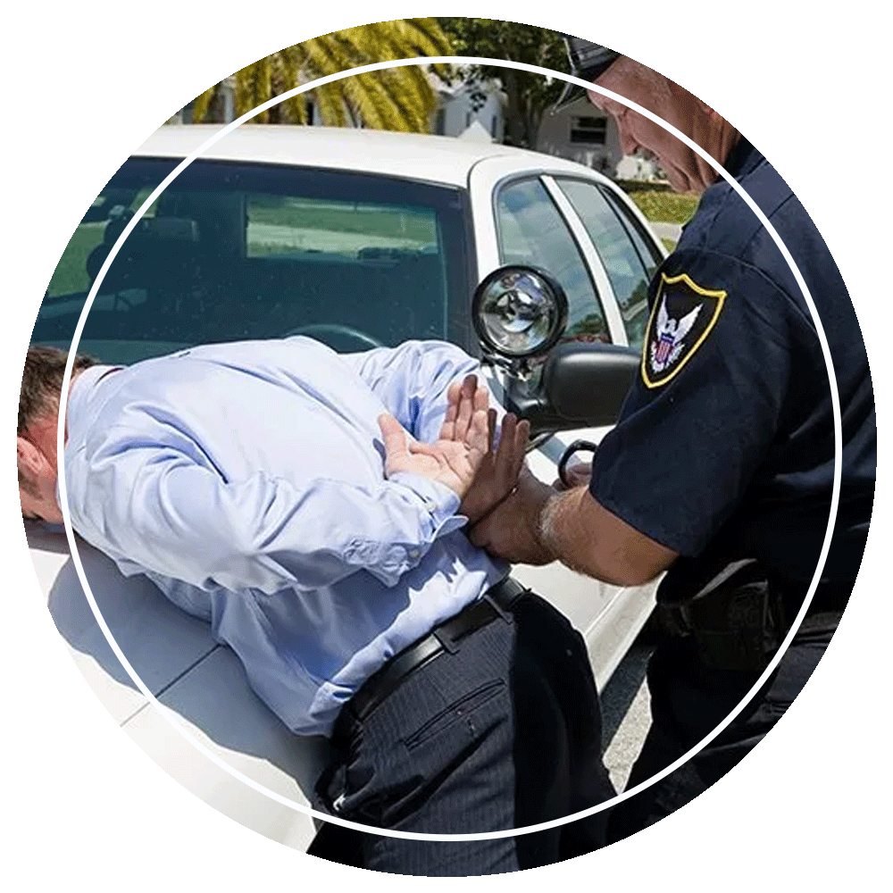 Policeman Handcuffing A Resisting Person — Eau Claire, WI — Cohen Law Offices, LLC