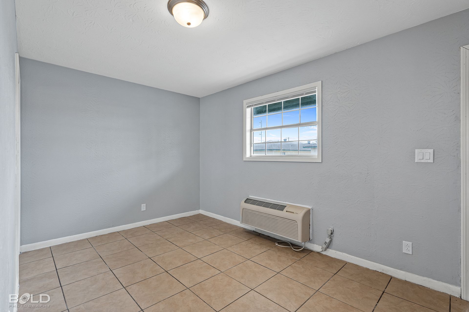 there is a window in the middle of the room .