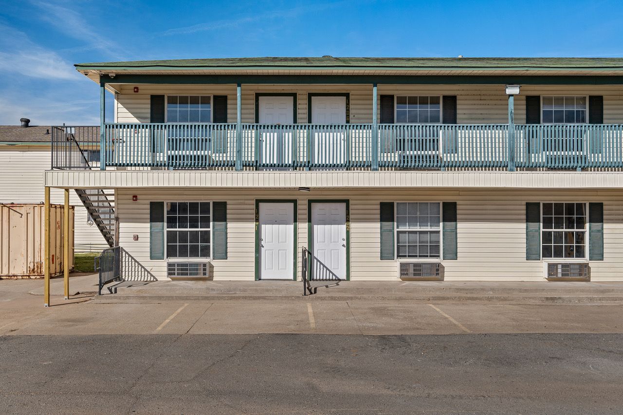 a motel with a lot of windows and balconies