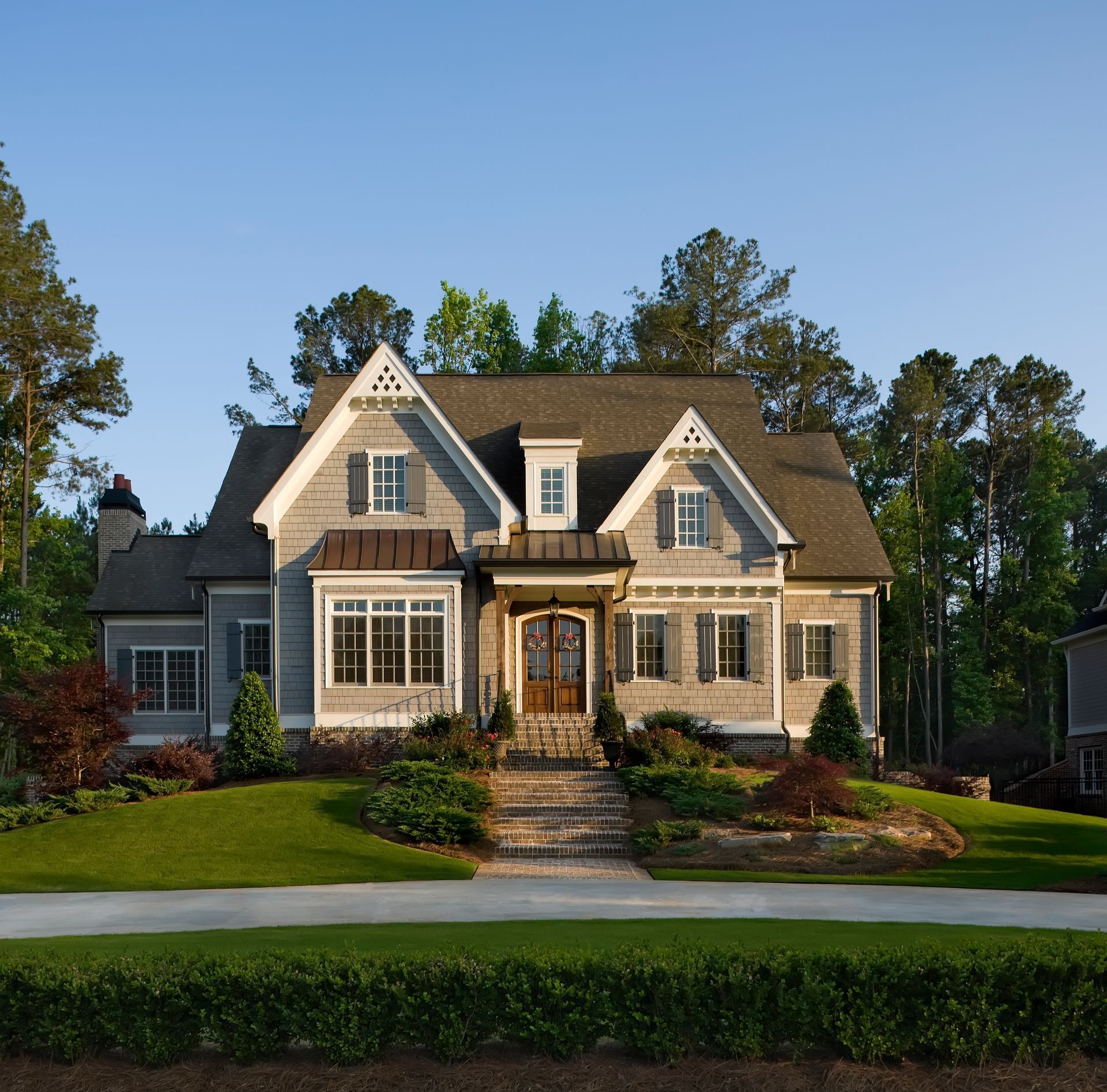 Front view of a beautiful, exterior home, showcasing a well-maintained home siding.