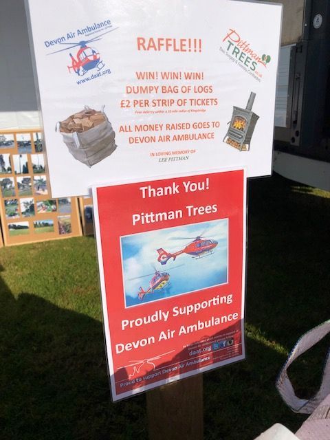 A sign that says raffle and thank you pittman trees