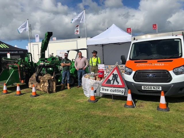 A group of men are standing in front of a ford van.