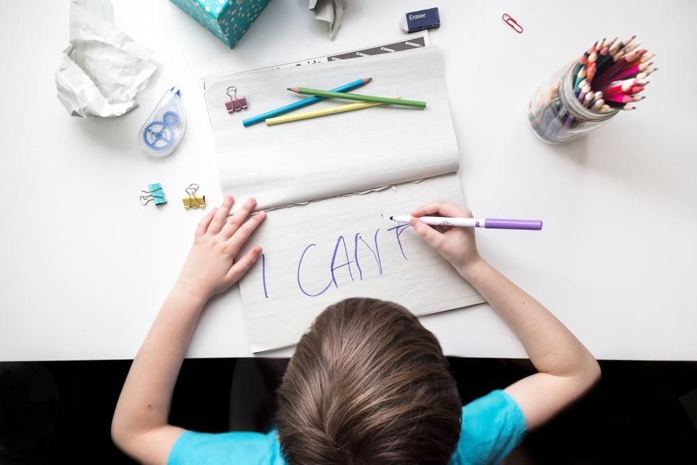 A Young Boy Is Writing I Can't — Oracle Psychology Child & Adolescent Psychologists Newcastle in Newcastle, NSW