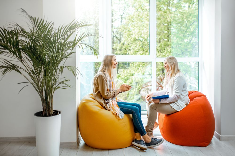 Two Women Sit on Bean Bags — Oracle Psychology Child & Adolescent Psychologists Newcastle in Newcastle, NSW