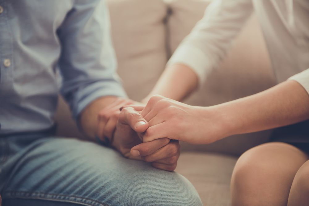 Two People Holding Hands, a Sign of Support or Comfort — Oracle Psychology Child & Adolescent Psychologists Newcastle in Newcastle, NSW