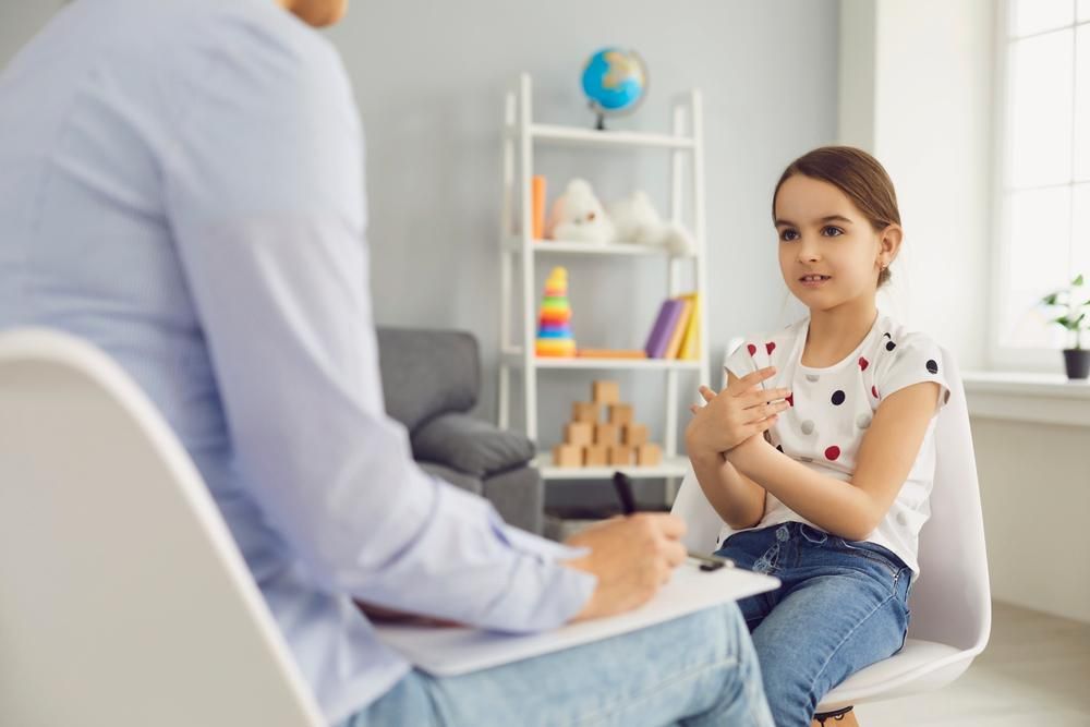 A Little Girl Talking to A Psychologist— Oracle Psychology Child & Adolescent Psychologists Newcastle in Newcastle, NSW