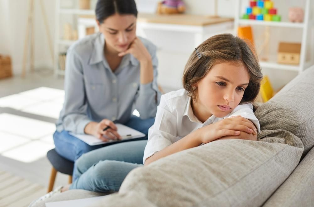 A Girl on A Couch Talking to A Psychologist — Oracle Psychology Child & Adolescent Psychologists Newcastle in Newcastle, NSW