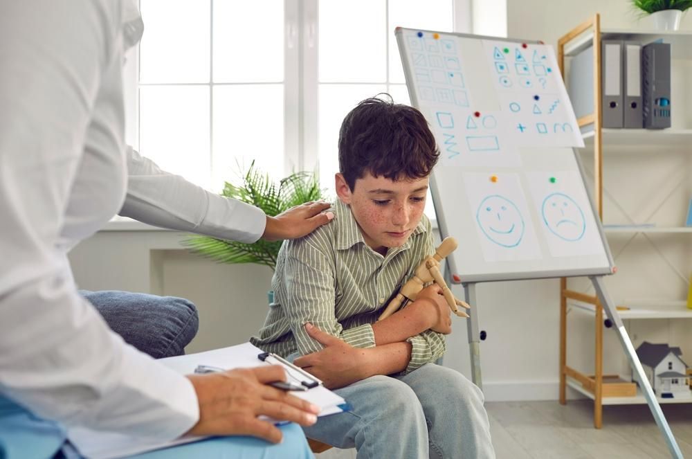 A Doctor Comforting A Boy — Oracle Psychology Child & Adolescent Psychologists Newcastle in Newcastle, NSW