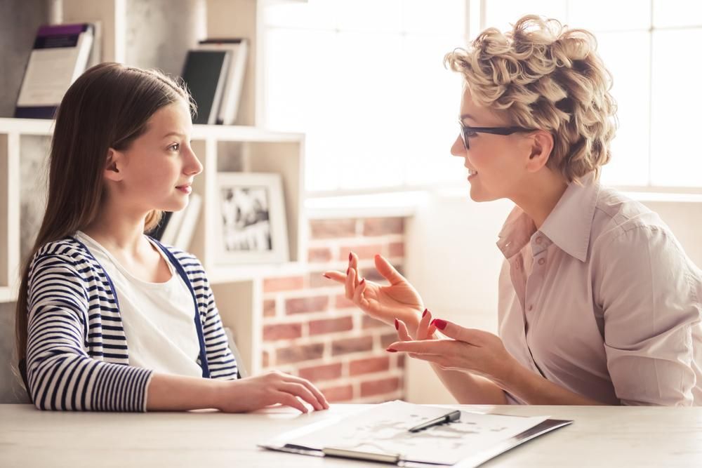 A Psychologist Talking to A Little Girl — Oracle Psychology Child & Adolescent Psychologists Newcastle in Newcastle, NSW
